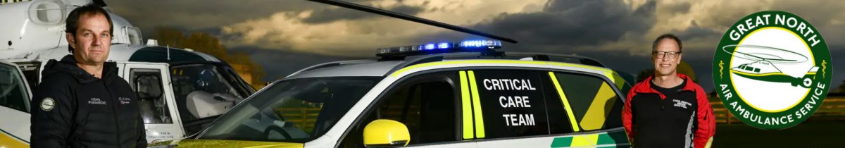 Image of the Great North Air Ambulance Critical Care Team with helicopter and car